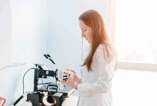 Woman printing a mug with the Black and White London logo